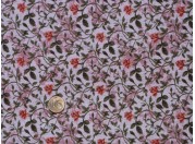 Tissu patchwork rose à fleurs orangées et feuilles vertes