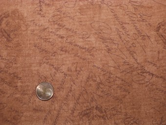 Tissu patchwork ocre à écriture Tissu patchwork ocre à écriture